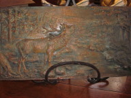 Bronze relief of elk